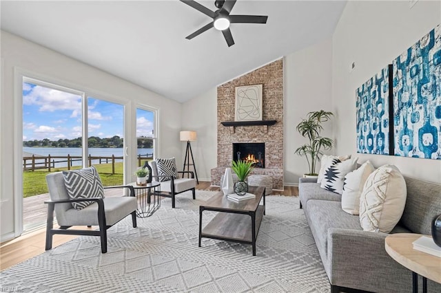 1545 Lake James Dr, Virginia Beach, VA 23464 - living room featuring a water view, high vaulted ceiling, wood finished floors, ceiling fan, and a fireplace