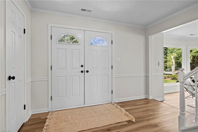 1545 Lake James Dr, Virginia Beach, VA 23464 - foyer with wood finished floors, plenty of natural light, and crown molding