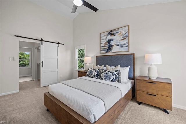 1545 Lake James Dr, Virginia Beach, VA 23464 - bedroom with light carpet, a barn door, ceiling fan, and high vaulted ceiling