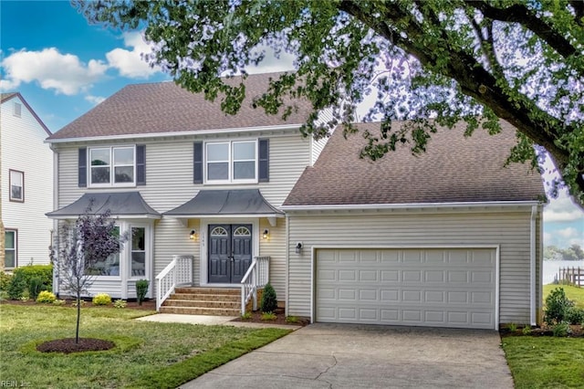 1545 Lake James Dr, Virginia Beach, VA 23464 - view of front of house featuring concrete driveway, a garage, a front lawn, and a shingled roof