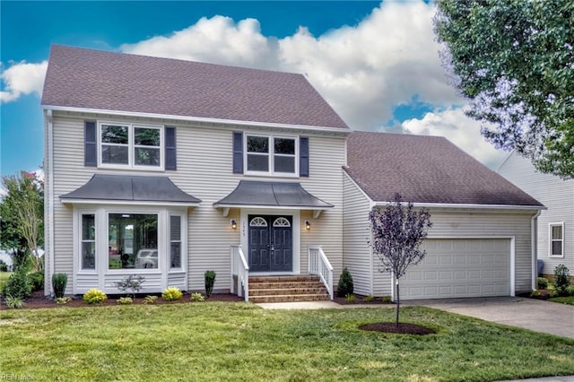 1545 Lake James Dr, Virginia Beach, VA 23464 - traditional home with an attached garage, driveway, a front yard, and a shingled roof