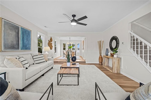 1545 Lake James Dr, Virginia Beach, VA 23464 - living room with stairway, wood finished floors, a chandelier, ceiling fan, and crown molding