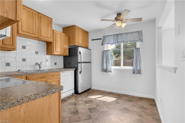 3555 Campion Ave, Virginia Beach, VA 23462 - kitchen with white dishwasher, freestanding refrigerator, dark countertops, decorative backsplash, and ceiling fan