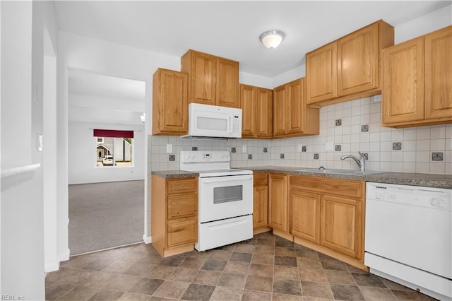 3555 Campion Ave, Virginia Beach, VA 23462 - kitchen featuring white appliances, tasteful backsplash, dark countertops, dark carpet, and stone finish floors