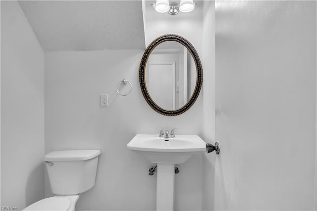 3555 Campion Ave, Virginia Beach, VA 23462 - half bathroom featuring toilet and lofted ceiling