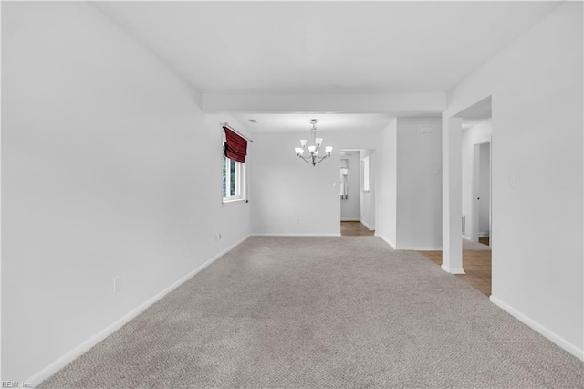 3555 Campion Ave, Virginia Beach, VA 23462 - carpeted empty room featuring a chandelier and baseboards