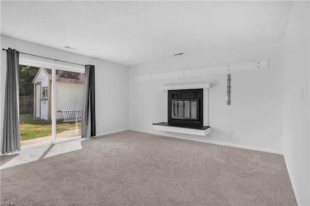 3555 Campion Ave, Virginia Beach, VA 23462 - unfurnished living room with carpet, a glass covered fireplace, radiator heating unit, and a textured ceiling