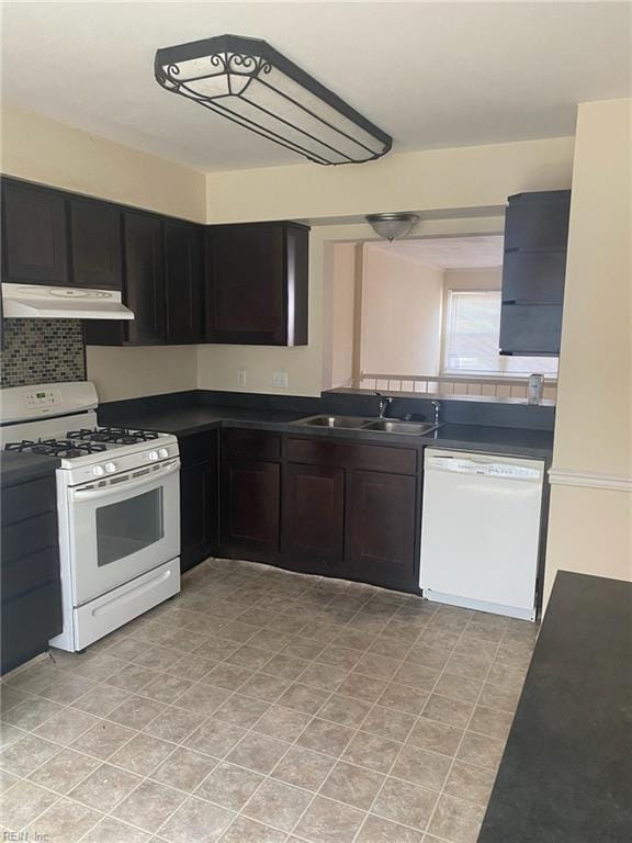 1623 Mantane Arch Arch, Virginia Beach, VA 23454 - kitchen featuring white appliances, under cabinet range hood, dark countertops, and decorative backsplash