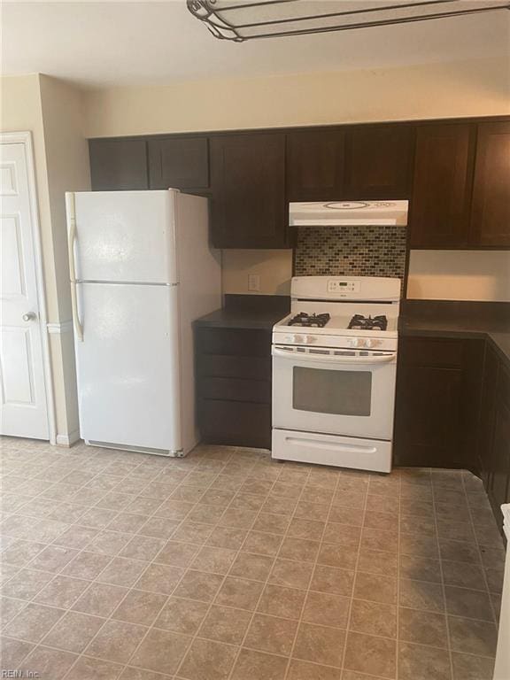 1623 Mantane Arch Arch, Virginia Beach, VA 23454 - kitchen with white appliances, under cabinet range hood, dark countertops, and dark brown cabinetry