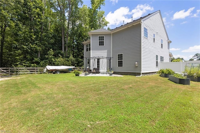 4202 Ravine Gap Dr, Suffolk, VA 23434 - rear view of property featuring a patio area, a garden, and a fenced backyard