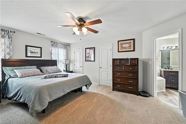 315 Sawmill Arch, Chesapeake, VA 23323 - bedroom featuring light carpet, a textured ceiling, connected bathroom, and ceiling fan