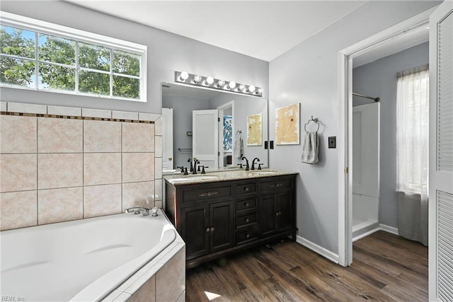 315 Sawmill Arch, Chesapeake, VA 23323 - bathroom featuring a bath, double vanity, wood finished floors, and a shower