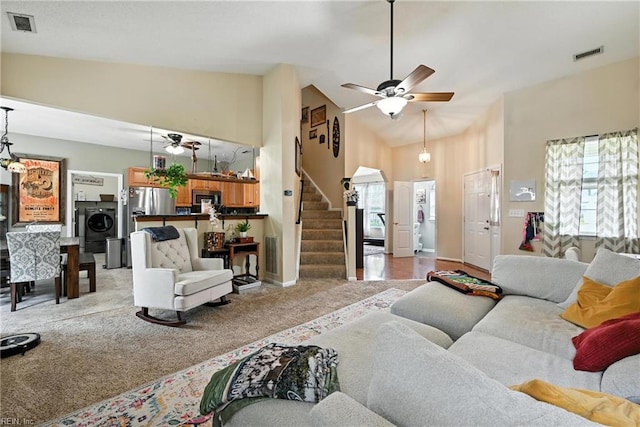 315 Sawmill Arch, Chesapeake, VA 23323 - living area with washer / clothes dryer, stairs, light colored carpet, ceiling fan, and a high ceiling