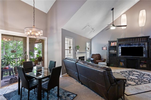 313 River Forest Rd, Virginia Beach, VA 23454 - dining space with high vaulted ceiling, a fireplace, a chandelier, and ceiling fan