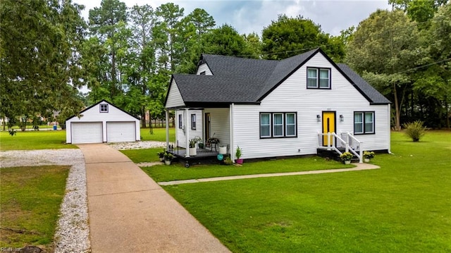 4057 Woodland Dr, Chesapeake, VA 23321 - bungalow with an outdoor structure, a detached garage, roof with shingles, and a front yard