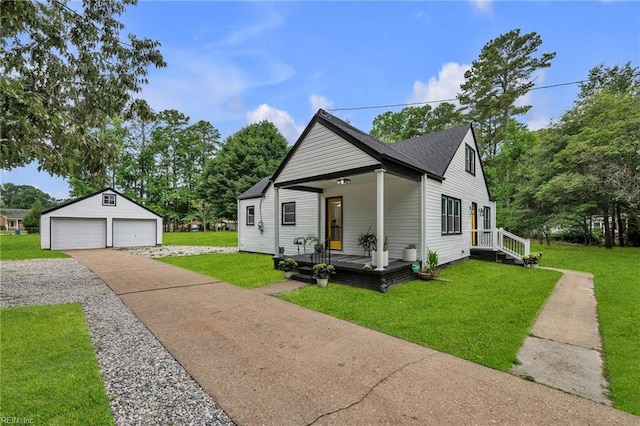 4057 Woodland Dr, Chesapeake, VA 23321 - view of front facade featuring a detached garage, an outdoor structure, a front lawn, and a porch