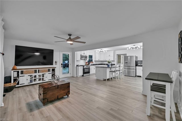 4057 Woodland Dr, Chesapeake, VA 23321 - living area featuring a chandelier, ceiling fan, and light wood finished floors