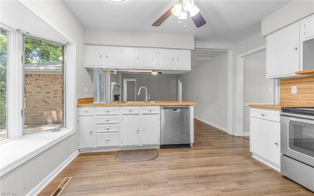 5991 Clear Springs Rd, Virginia Beach, VA 23464 - kitchen with appliances with stainless steel finishes, white cabinets, and a ceiling fan