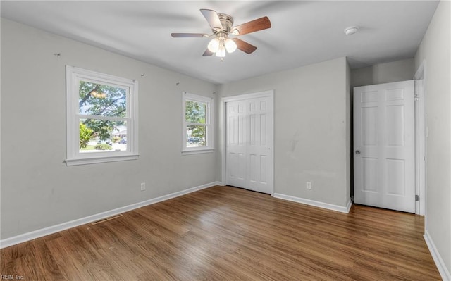 5991 Clear Springs Rd, Virginia Beach, VA 23464 - unfurnished bedroom featuring wood finished floors, a closet, and a ceiling fan
