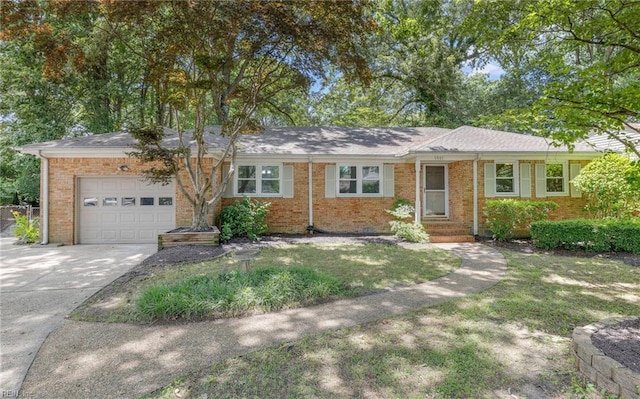 5991 Clear Springs Rd, Virginia Beach, VA 23464 - ranch-style house featuring a garage, brick siding, concrete driveway, and a front lawn