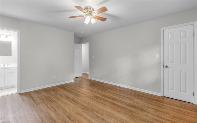 5991 Clear Springs Rd, Virginia Beach, VA 23464 - unfurnished bedroom featuring light wood finished floors, ensuite bath, and a ceiling fan