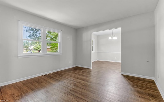 5991 Clear Springs Rd, Virginia Beach, VA 23464 - empty room featuring a chandelier and dark wood-style floors
