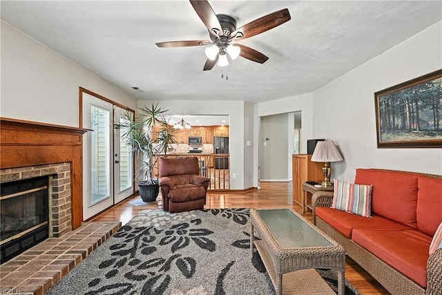 4300 Galston Ct, Chesapeake, VA 23321 - living room featuring wood finished floors, a brick fireplace, and ceiling fan