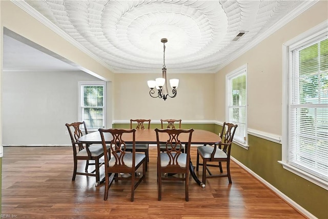 4300 Galston Ct, Chesapeake, VA 23321 - dining area featuring healthy amount of natural light, wood finished floors, a chandelier, and crown molding