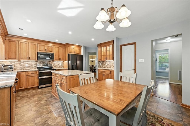 4300 Galston Ct, Chesapeake, VA 23321 - dining area featuring a chandelier, recessed lighting, and light stone finish floors