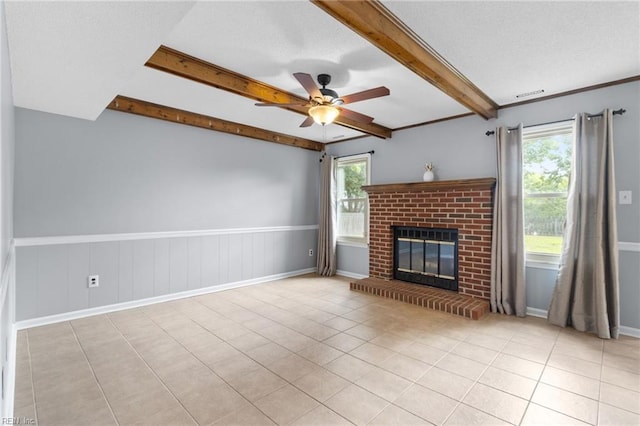 1760 Moonstone Dr, Virginia Beach, VA 23456 - unfurnished living room with healthy amount of natural light, ceiling fan, beam ceiling, a fireplace, and tile patterned floors