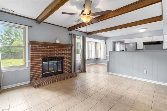 1760 Moonstone Dr, Virginia Beach, VA 23456 - unfurnished living room with a ceiling fan, a fireplace, beam ceiling, healthy amount of natural light, and light tile patterned floors