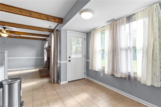 1760 Moonstone Dr, Virginia Beach, VA 23456 - entrance foyer featuring beam ceiling, a brick fireplace, light tile patterned floors, ceiling fan, and a wainscoted wall
