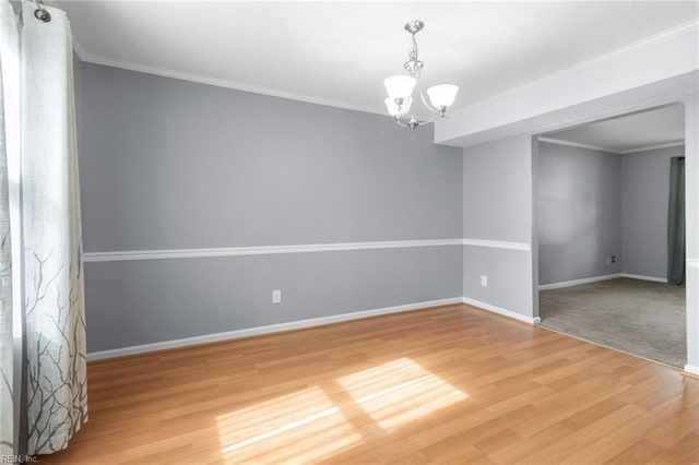 1760 Moonstone Dr, Virginia Beach, VA 23456 - empty room featuring a chandelier, light wood-style flooring, and ornamental molding