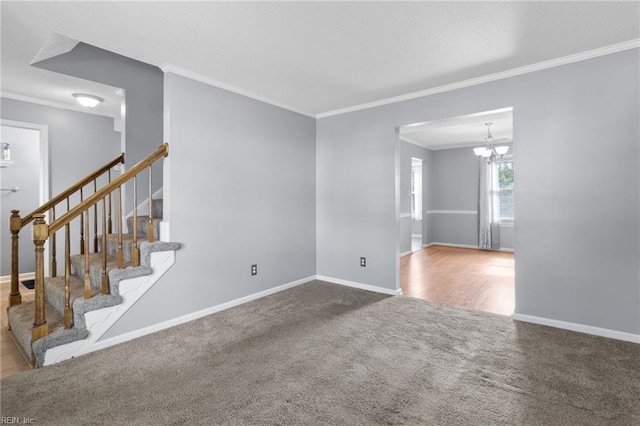 1760 Moonstone Dr, Virginia Beach, VA 23456 - carpeted spare room featuring ornamental molding, a chandelier, and stairway