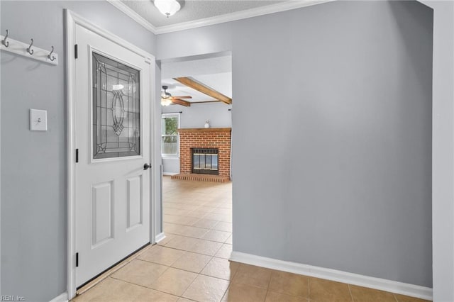 1760 Moonstone Dr, Virginia Beach, VA 23456 - foyer entrance with light tile patterned floors, ceiling fan, a brick fireplace, and ornamental molding