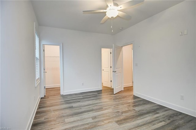 6424 Atlantic Ave, Virginia Beach, VA 23451 - unfurnished bedroom with wood finished floors, a spacious closet, a closet, and ceiling fan