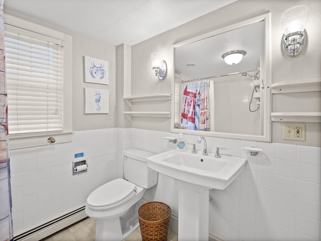 bathroom with tile patterned floors, toilet, tile walls, baseboard heating, and a shower with shower curtain