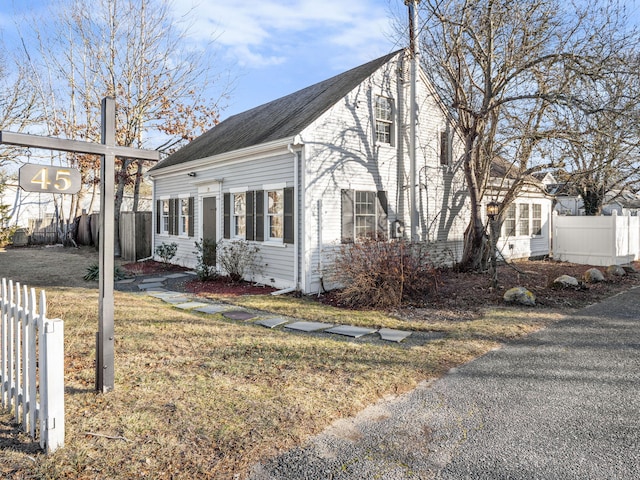 view of side of property with a yard