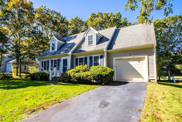 53 Snead Dr, Mashpee, MA 02649 - cape cod house featuring a garage and a front lawn