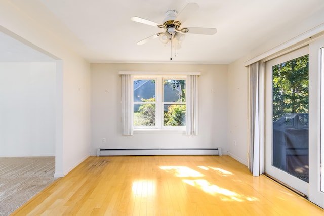 53 Snead Dr, Mashpee, MA 02649 - spare room with ceiling fan, a baseboard heating unit, and light hardwood / wood-style floors