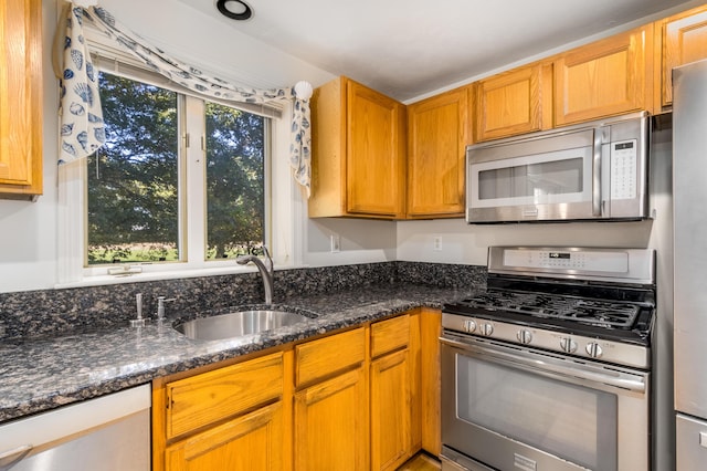 53 Snead Dr, Mashpee, MA 02649 - kitchen featuring sink, dark stone countertops, and appliances with stainless steel finishes