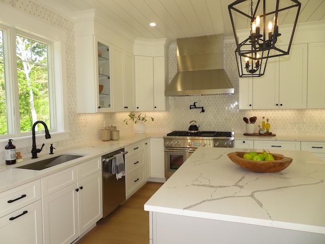 18 Pleasant Park Dr, Mashpee, MA 02649 - kitchen featuring wall chimney range hood, stainless steel appliances, plenty of natural light, a chandelier, and ornamental molding