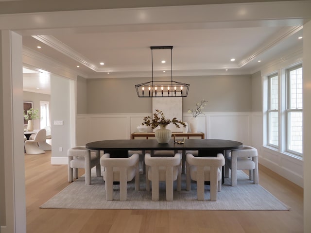 18 Pleasant Park Dr, Mashpee, MA 02649 - dining room with a raised ceiling, a decorative wall, crown molding, light wood finished floors, and wainscoting
