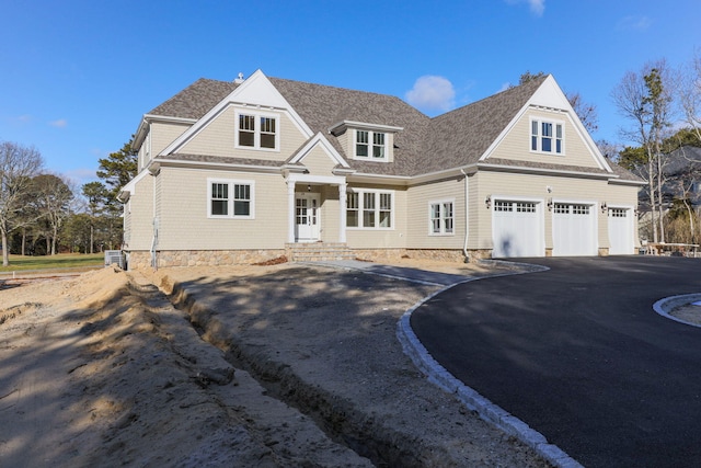 craftsman-style home with a garage