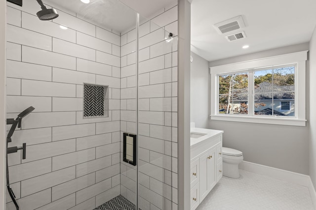 bathroom with tile patterned floors, toilet, walk in shower, and vanity