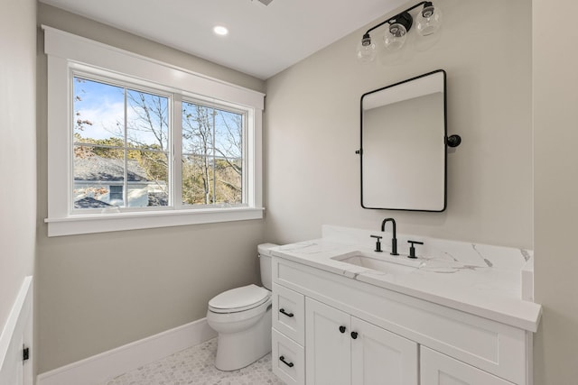 bathroom featuring vanity, toilet, and tile patterned flooring