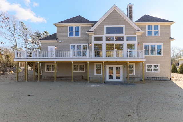 view of front facade with a deck and french doors