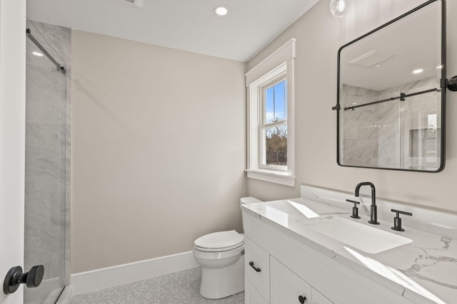 bathroom with an enclosed shower, vanity, toilet, and tile patterned flooring