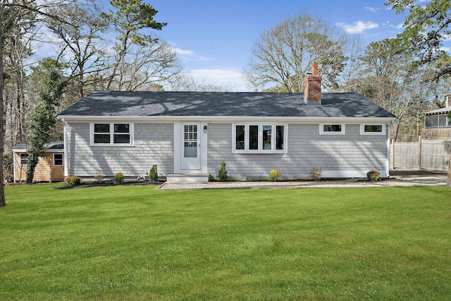 view of front of property featuring a chimney and roof with shingles