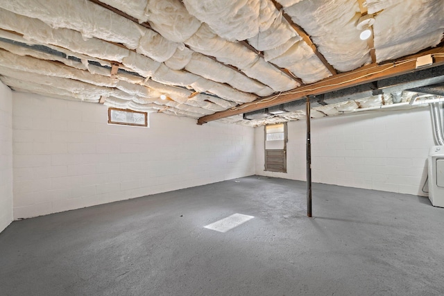 basement featuring washer / dryer and healthy amount of natural light